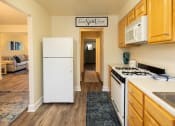 Thumbnail 7 of 23 - Kitchen with white appliances at Rockdale Gardens Apartments*, Baltimore, MD