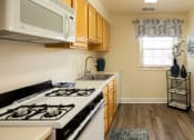 Thumbnail 6 of 23 - Kitchen with a stove at Rockdale Gardens Apartments*, Baltimore, MD