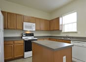 Thumbnail 3 of 16 - Huge kitchen with built in center island and natural light at The Pointe at Manorgreen Townhomes, Baltimore, 21220