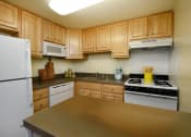 Thumbnail 10 of 19 - Bright kitchen with plenty of cabinets at Winston Apartments, Baltimore, 21239