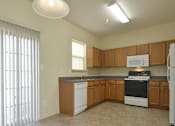 Thumbnail 4 of 16 - Massive kitchen with plenty of food storage and eat in area at The Pointe at Manorgreen Townhomes, Baltimore