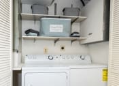 Thumbnail 16 of 21 - a washer and dryer are located in the laundry room at Chapel Valley Townhomes, Baltimore, MD 21236