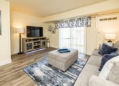 Thumbnail 2 of 32 - Living room with a couch at Seven Oaks Townhomes, Edgewood