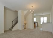 Thumbnail 6 of 16 - Main level with living room and dining room at The Pointe at Manorgreen Townhomes, Baltimore