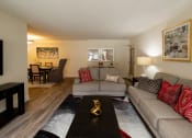 Thumbnail 6 of 28 - Living room with two couches and a coffee table at Ivy Hall Apartments*, Towson, Maryland.