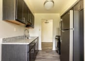 Thumbnail 6 of 33 - Kitchen with black appliances at Seminary Roundtop Apartments, Lutherville, Maryland