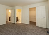 Thumbnail 16 of 22 - a bedroom with a closet and a toilet at Carlson Woods Townhomes, Baltimore