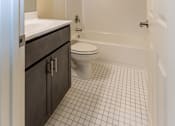 Thumbnail 13 of 22 - a bathroom with a toilet sink and bathtub at Carlson Woods Townhomes, Maryland