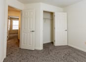 Thumbnail 21 of 22 - a bedroom with two closets and a carpeted flooring at Carlson Woods Townhomes, Maryland, 21244