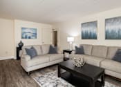 Thumbnail 4 of 25 - Living room with a couch and a tv at Ivy Hall Apartments*, Towson, MD 21204