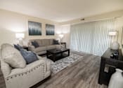 Thumbnail 2 of 25 - Living room with a couch and a tv at Ivy Hall Apartments*, Towson, MD 21204