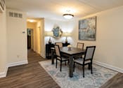 Thumbnail 5 of 25 - Dining room with a wooden table and chairs at Ivy Hall Apartments*, Towson
