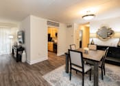 Thumbnail 6 of 25 - Living and dining room view with table and chairs at Ivy Hall Apartments*, Towson, MD 21204