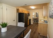 Thumbnail 9 of 25 - An eat-in kitchen with wooden cabinets and a granite countertop  at Ivy Hall Apartments*, Maryland, 21204