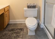 Thumbnail 21 of 25 - Bathroom with toilet and walk-in shower at Ivy Hall Apartments*, Towson, MD 21204.