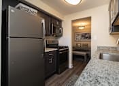 Thumbnail 4 of 16 - Kitchen with stainless steel appliances at Seminary Roundtop Apartments, Lutherville, Maryland, 21093