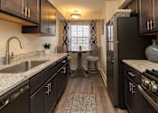 Thumbnail 2 of 16 - Kitchen with stainless steel appliances at Seminary Roundtop Apartments, Lutherville, Maryland, 21093