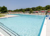 Thumbnail 23 of 32 - Large pool with a clear blue sky in the background at Seven Oaks Townhomes, Edgewoode, MD, 21040