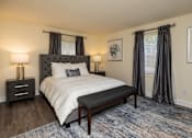 Thumbnail 12 of 32 - A bedroom with bed and windows at Spring Hill Apartments & Townhomes, Baltimore, MD 21234