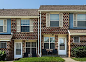 Thumbnail 1 of 32 - Exterior photo of townhomes at Spring Hill Apartments & Townhomes, Baltimore, MD 21234.