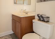 Thumbnail 17 of 36 - Bathroom with toilet and cabinets under the sink