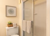 Thumbnail 21 of 28 - Small bathroom with a toilet and a shower at Ivy Hall Apartments*, Towson, MD 21204