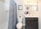 Thumbnail 10 of 24 - Bathroom with a white sink and toilet next to a shower at Fairbrook Park, Maryland