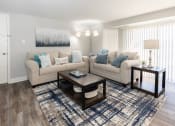 Thumbnail 1 of 24 - A living room with two couches and a coffee table at Fairbrook Park, Baltimore