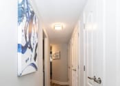 Thumbnail 8 of 24 - a hallway with a painting on the wall at Fairbrook Park, Baltimore, MD 21244