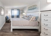 Thumbnail 16 of 24 - a bedroom with a bed and dresser at Fairbrook Park, Maryland