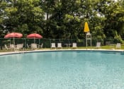 Thumbnail 20 of 24 - a swimming pool with chaise lounge chairs and umbrellas at Fairbrook Park, Maryland, 21244