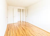 Thumbnail 15 of 22 - First bedroom with closets at Foxridge Townhomes, Baltimore, 21221
