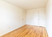 Thumbnail 18 of 22 - First bedroom with hardwood floors at Foxridge Townhomes, Baltimore Maryland