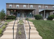 Thumbnail 1 of 22 - Front exterior at Foxridge Townhomes, Baltimore, MD