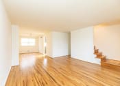 Thumbnail 7 of 22 - Spacious living room and kitchen at Foxridge Townhomes, Baltimore Maryland