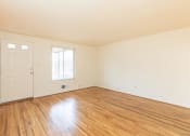 Thumbnail 5 of 22 - Well lit living room at Foxridge Townhomes, Baltimore, MD 21221
