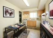 Thumbnail 3 of 12 - a kitchen and dining room with a table and chairs at Arbuta Arms Apartments*, Maryland, 21230