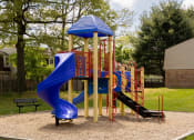 Thumbnail 22 of 23 - Playground with a blue slide at The Orchards at Severn Townhomes*, Maryland, 21144