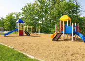 Thumbnail 23 of 24 - Playground with two slides and a swing set at Fairbrook Park, Baltimore