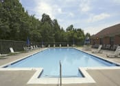 Thumbnail 28 of 31 - Beautiful private swimming pool with lounge chairs at Spring Hill Apartments & Townhomes, Baltimore