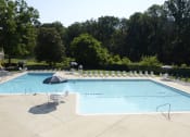 Thumbnail 22 of 29 - Lounging by the Pool at Woodridge Apartments, Maryland 21133