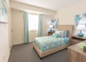 Thumbnail 8 of 15 - a bedroom with a bed and a window at Lawyers Hill Apartments, Elkridge, MD