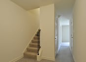 Thumbnail 10 of 16 - Staircase leading to the second level at The Pointe at Manorgreen Townhomes, Baltimore, 21220