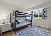 Thumbnail 19 of 19 - A bedroom with a bunk bed and a dresser.