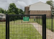 Thumbnail 24 of 29 - Dog park sign at Woodridge Apartments in Randallstown, MD 21133.