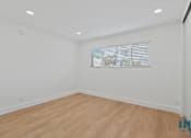 Thumbnail 21 of 30 - Bedroom with Vinyl Flooring, Recessed Lighting, and Window