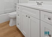 Thumbnail 23 of 30 - Bathroom with Shower Bath with Glass Door and Vanity Cabinet Storage