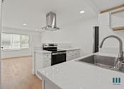 Thumbnail 15 of 30 - Open-Concept Kitchen, Dining, and Living Room Space