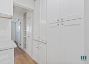 Thumbnail 12 of 30 - Ample Kitchen and Hallway Cabinet Storage