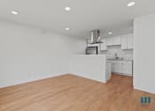 Thumbnail 13 of 30 - Open-Concept Kitchen and Dining Area